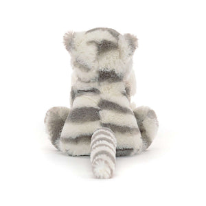 Ready for cozy adventures! Jellycat's Bashful Snow Tiger Soother shows off its fluffy form, cuddly blanket, and playful tail - a snuggle companion for all journeys.
