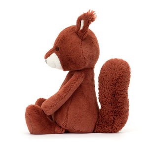 Side View: Side profile of the cuddly Jellycat Bashful Squirrel. Highlights the perfect size for little hands (suitable from birth), the soft, huggable texture, and the adorable stitched details on the face and the impressive, bushy tail. 