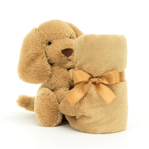 Ready for snuggles! The Jellycat Bashful Toffee Puppy Soother, with its wrapped soother and floppy ears, is a naptime essential. (Blanket wrapped up, front view)