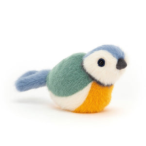 Jellycat Birdling Blue Tit plush bird with vibrant blue feathers and a soft yellow belly, viewed slightly angled.