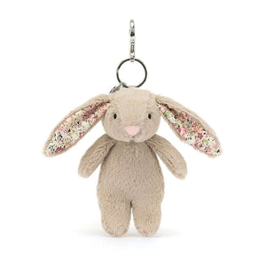 Meet the Blossom Beige Bunny Charm! This cutie features praline fur, adorable ditsy ears & a bouncy tail, ready to add cheer to any bag.