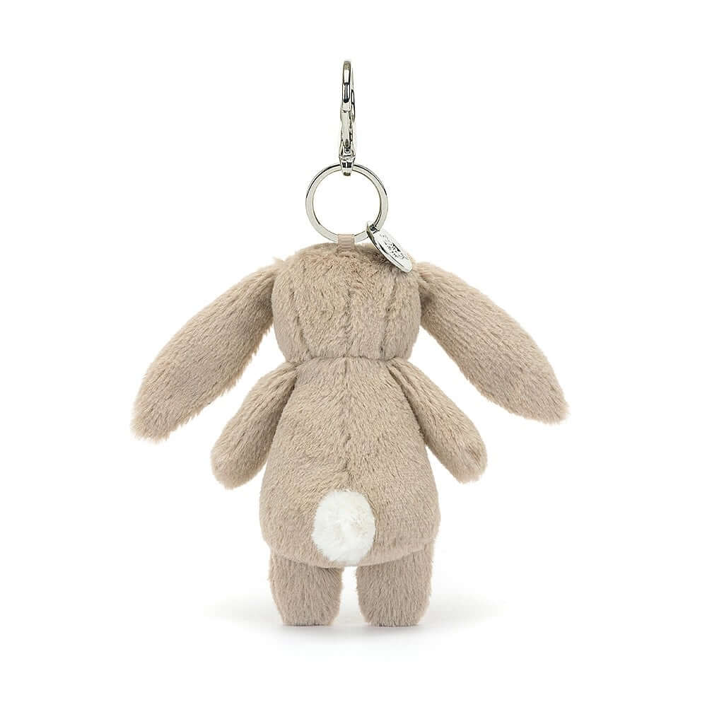 Check out the soft fur & bouncy tail of the Blossom Beige Bunny Charm! This adorable pal clips onto bags, spreading springtime vibes wherever you go. Hop to it & grab yours!