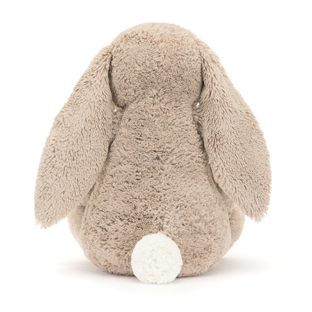 Rear view of Jellycat Blossom Beige Bunny ‘Petal,’ showing its soft beige fur and rounded tail.