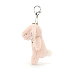 See the playful details of the Blossom Blush Bunny Charm! This soft friend boasts fluffy ears, a charming tail & a sturdy clip for endless adventures.