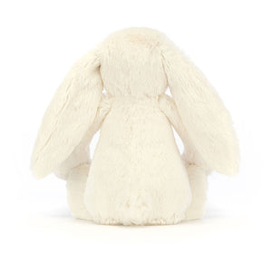 Back View: Jellycat  Blossom Bashful Bunny showcasing soft cream fur.