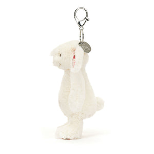 Side view of Jellycat Blossom Cream Bunny ‘Berry’ Bag Charm, showing its small size and adorable profile.