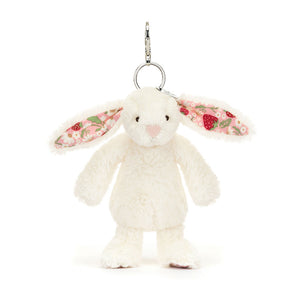 Front view of Jellycat Blossom Cream Bunny ‘Berry’ Bag Charm, showcasing its soft cream fur and floral-patterned ears.