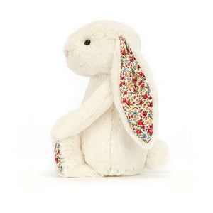 Side View: Floppy ears and flower power! Blossom Bashful Bunny shows off her soft fur and charming floral details.