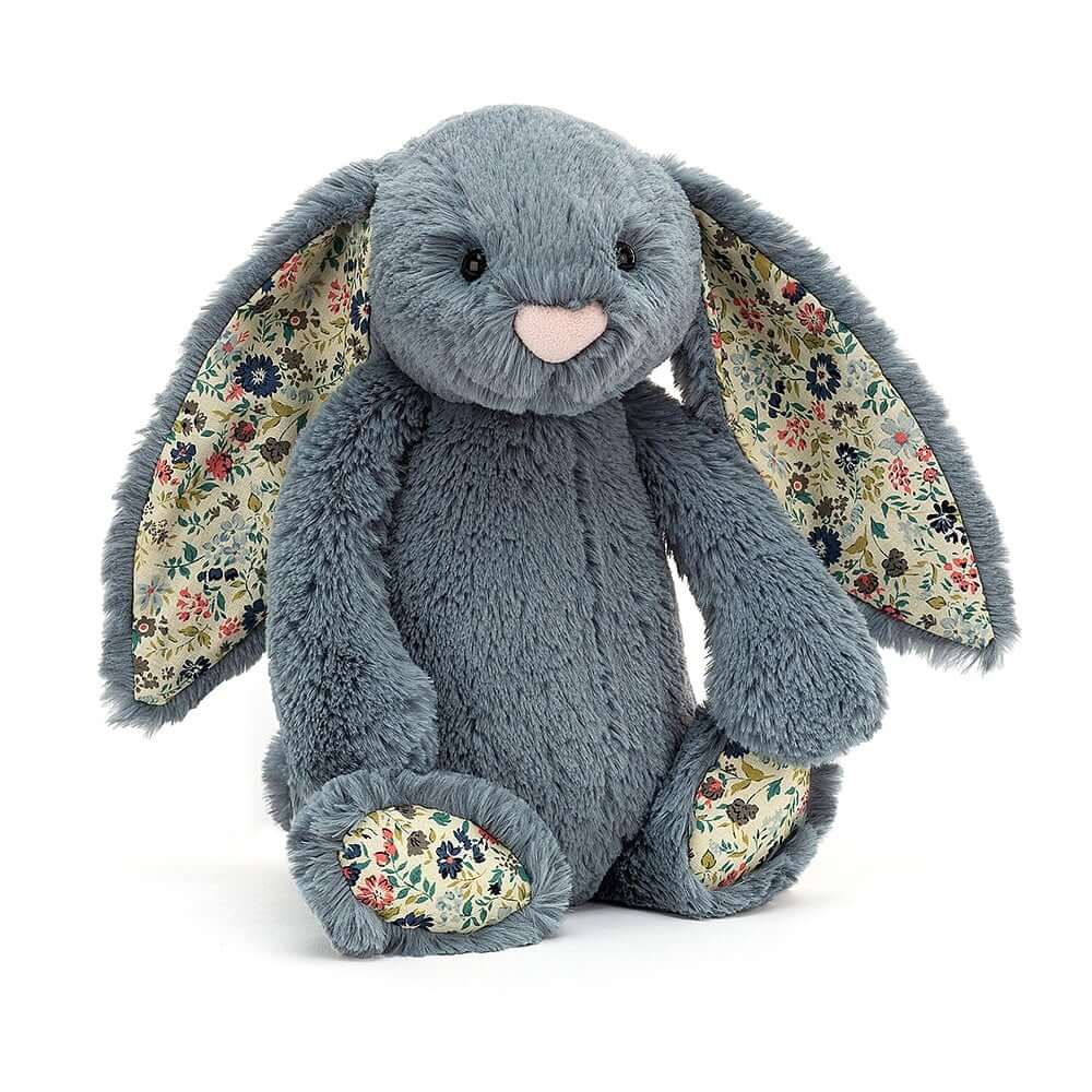 Dusky blue Jellycat Blossom Bunny cuddles close, revealing floral ears and paws - a vintage-inspired friend for all ages.