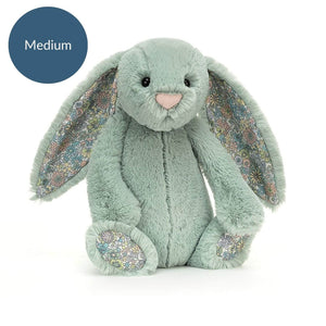 Jellycat Blossom Sage Bunny shows off fluffy tail & charming posy accents - a whimsical companion for adventures big & small. 