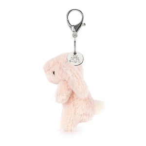Peek at the Bashful Blush Bunny's fluffy side! This mini charm features a gentle blush & a bopping tail for endless cuteness on-the-go.