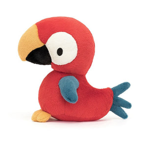 Jellycat Bodacious Beak Parrot perches proudly, showcasing bright plumage, white eye-patches & chunky beak - a parrot unlike any other!