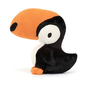 A close-up of the adorable Jellycat Bodacious Beak Toucan, featuring its soft plush texture, dapper bib, bold beak marks, and inquisitive expression.