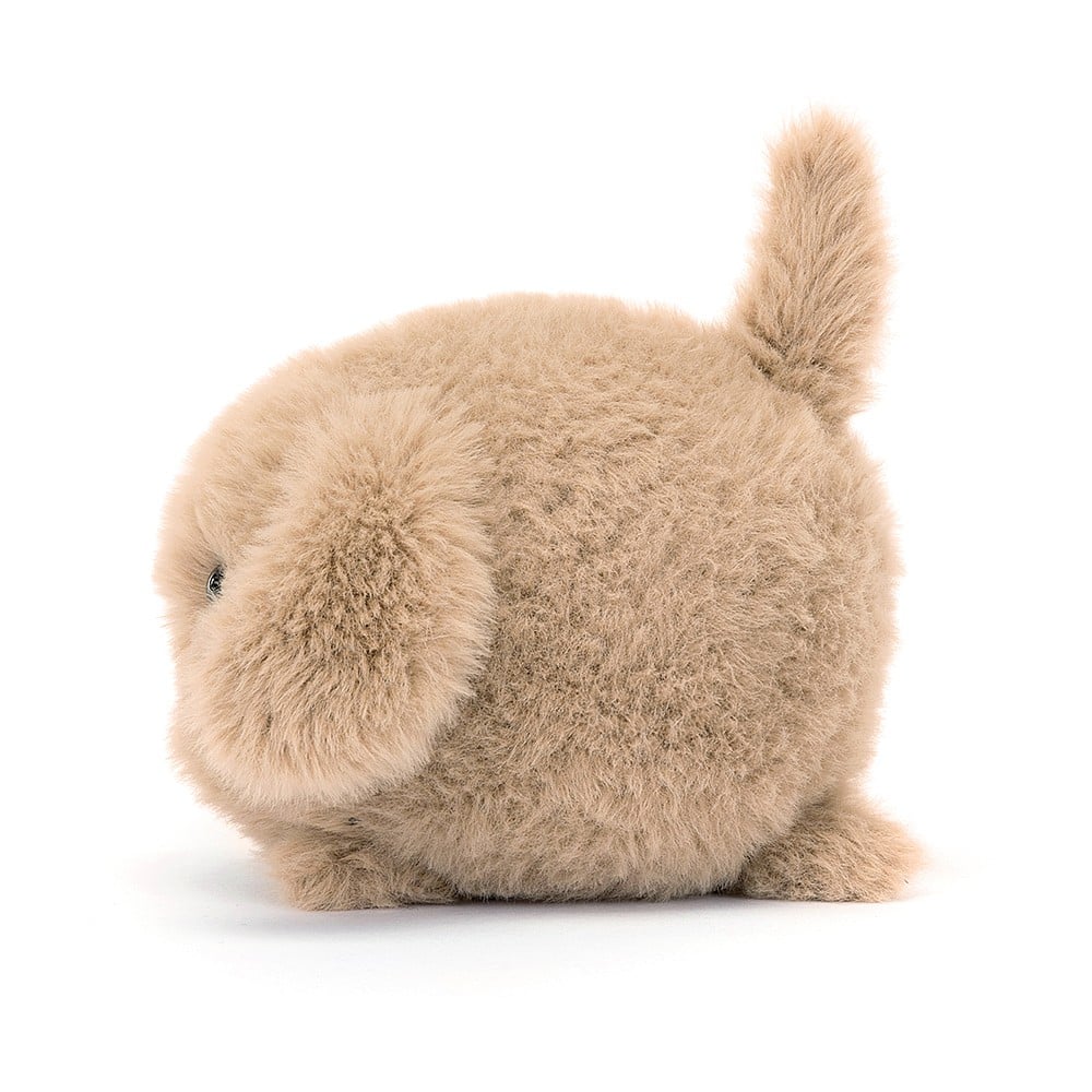 Side view of pawsibility! Jellycat's Caboodle Puppy showcases its cuddly form, soft fur, and perky tail from the side. Ready for pocket-sized adventures.