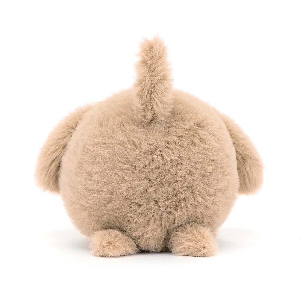 Tailored for cuddles: The back view of Jellycat's Caboodle Puppy reveals its soft fur, perky tail, and cute details. Perfect for cozy snuggles after pocket-sized escapades.