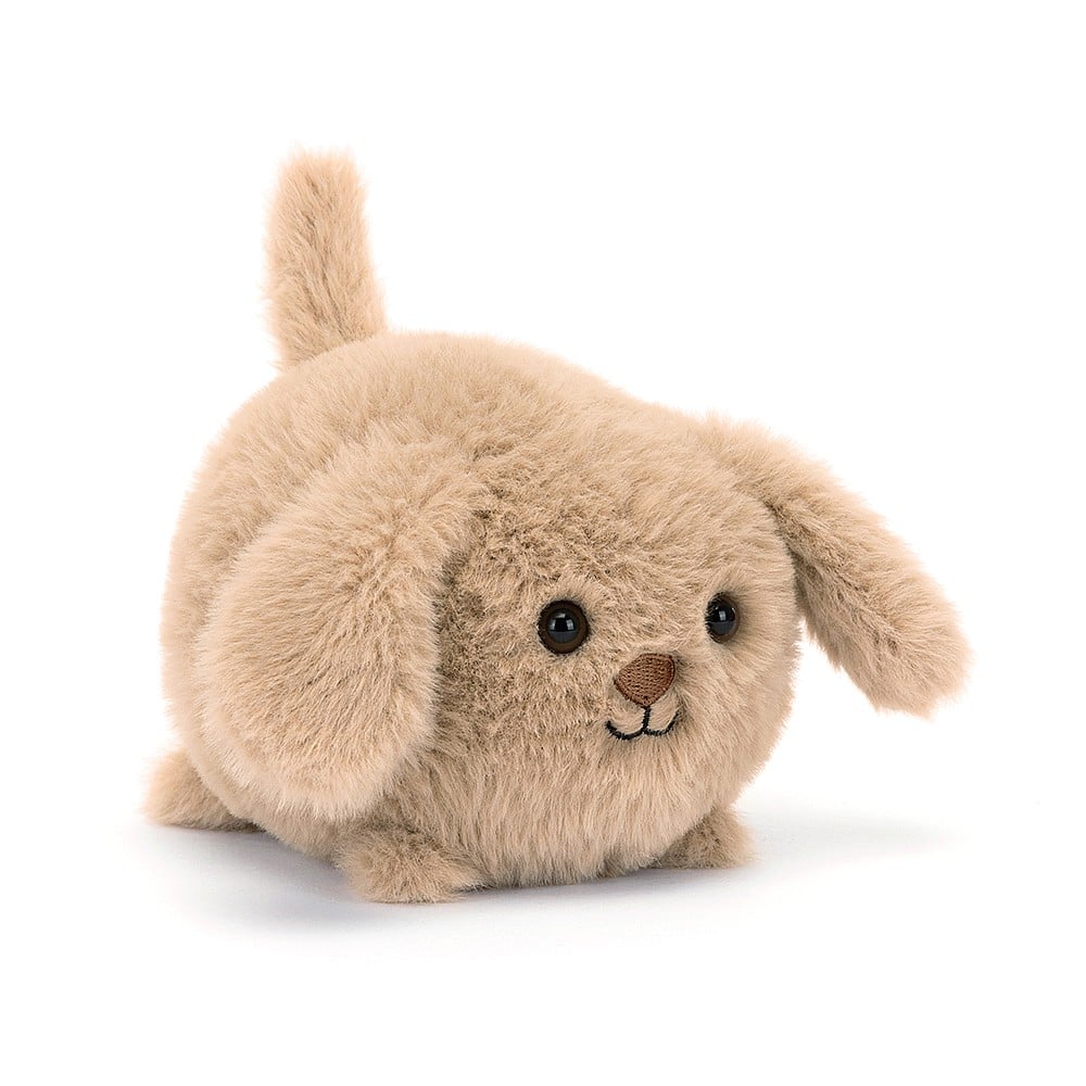 Pocket-sized pup at an angle! Jellycat's Caboodle Puppy boasts irresistible cuteness with soft praline fur, a cheeky smile, and floppy ears. Ready for adventures!
