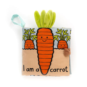 Jellycat Carrot Book cover featuring a smiling orange carrot with a plush green top, surrounded by illustrated carrots and garden scenery.