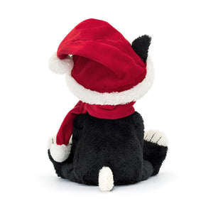 Jellycat Christmas Jack from behind, showcasing his fluffy tail and the full view of his red velvet hat.