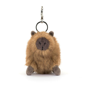 Front view of the Jellycat Clyde Capybara Bag Charm, highlighting its charming face and diddy brown suedette snout.