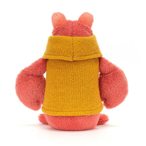 Set sail for cuddles! A captivating Jellycat Cozy Crew Lobster, seen from behind. The soft, peachy-pink plush and stylish mustard rollneck jumper make him a cuddly companion. 
