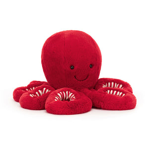 Product slightly to an angle: Jellycat Cranberry Octopus plush toy in profile, showing its red mantle and curly arms.