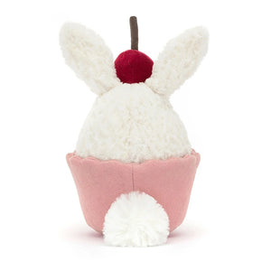 Who needs frosting when you have a cherry hat and fluffy tail? Meet the Jellycat Dainty Dessert Bunny Cupcake, a charming plush surprise for any occasion.