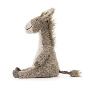 Side view of adventure: Jellycat's Dario Donkey showcases his soft fur, sturdy hooves, and playful tail from the side. Ready for imaginative expeditions.
