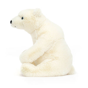 Side view of Jellycat Elwin Polar Bear showcasing his plump design and cuddly texture.