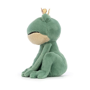 A cuddly Jellycat Fabian Frog Prince in profile, showcasing his soft golden crown, two-tone fur (green and beige), and endearing bobbly toes. He's ready for royal hugs!