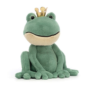 A delightful Jellycat Fabian Frog Prince, tilted at an angle, with a wide smile and short two-tone fur (green and beige). He wears a soft golden crown and boasts bobbly toes.