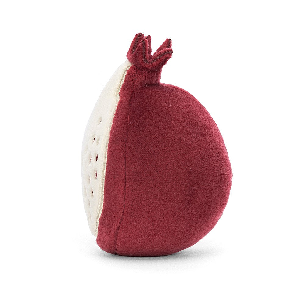 Side:  This adorable Jellycat Fabulous Fruit Pomegranate plush shows off its plump, round body, velvety texture, and the delightful texture of its stitched red pips.