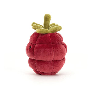Side view of the Jellycat Fabulous Fruit Raspberry plush, highlighting its plump shape, soft fur, and cute green stalk beret perched on its head.