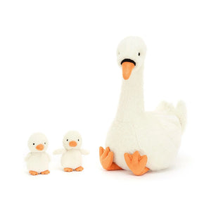 An Image of Jellycat Featherful Swan  and  two cygnets sitting to the side.