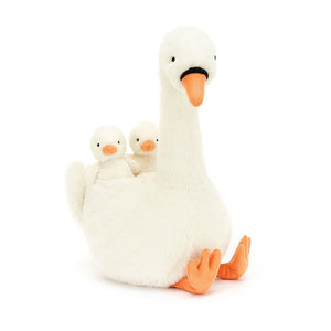 Image of Jellycat Featherful Swan, a luxuriously soft, plush swan with creamy white fur and bright orange accents. The swan has suedette feet and beak, and piping details. Two tiny cygnets are nestled within the swan's wings.