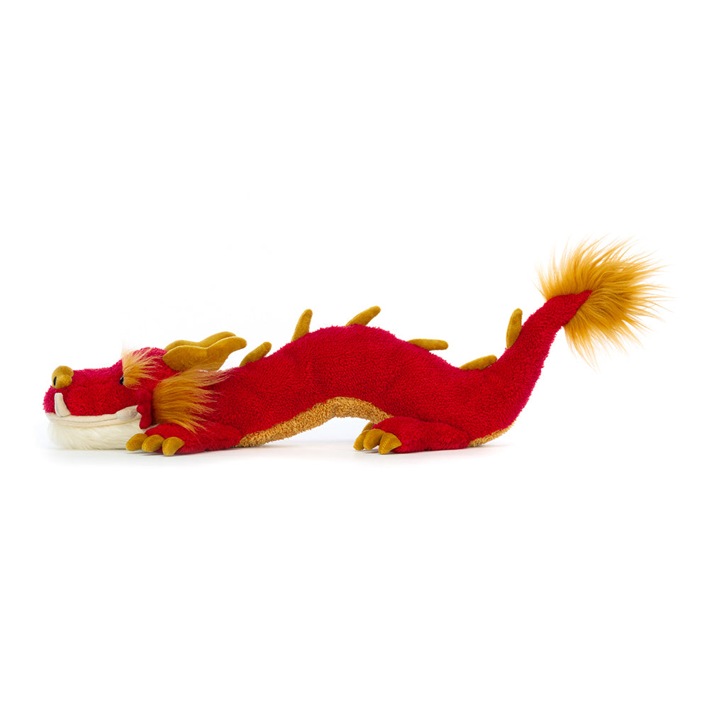 Side View: Jellycat Festival Dragon plush red dragon with golden accents.
