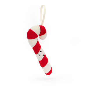 Front view of Jellycat Festive Folly Candy Cane ornament, showcasing its smiley face and cream grosgrain ribbon.