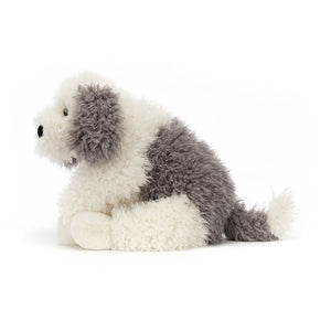 Side profile of Jellycat Floofie Sheepdog, showcasing its long, shaggy fur, relaxed pose, and bushy tail.