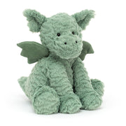 Front: A super soft and cuddly Jellycat Fuddlewuddle Dragon with perky ears, a friendly embroidered smile, and petite suedey wings folded at its sides.