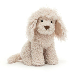Front: A luxuriously soft Jellycat Georgiana Poodle with a curious expression, stitched eyes, and delightfully messy champagne-colored fur. Her long, scruffy ears flop down and her tail curves playfully.