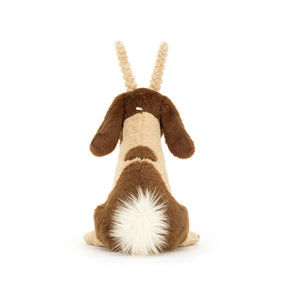 Back view of the Jellycat Glenny Goat plush, displaying its fluffy cream tail and the texture of its plush fur.