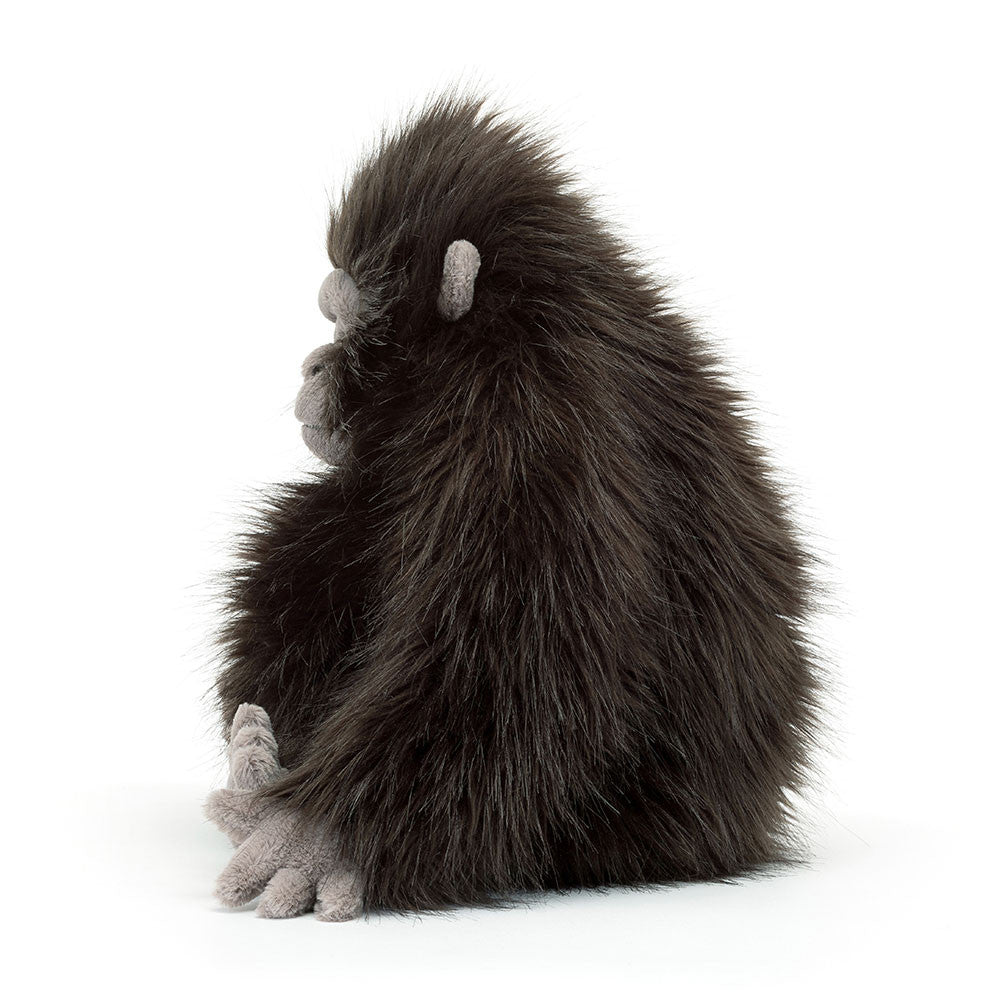Side view of Jellycat Gomez Gorilla showcasing his muscular arms and plush design.