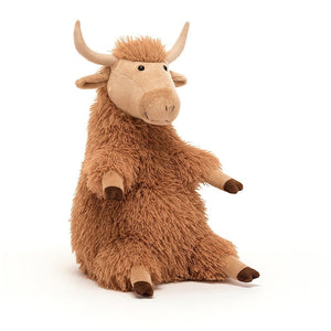 Front: A shaggy ginger Jellycat Highland Cow named Herbie with floppy ears, cocoa-dipped hooves, and soft suedey horns.