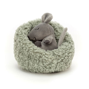 Adorable Jellycat Hibernating Mouse plush toy, angled view, showcasing its sleepy expression and cosy mossy bed.