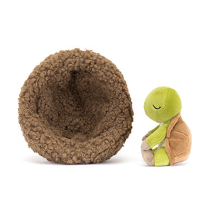 Side profile of the Jellycat Hibernating Tortoise, showcasing its detailed shell, fern-green fur and cosy nest.