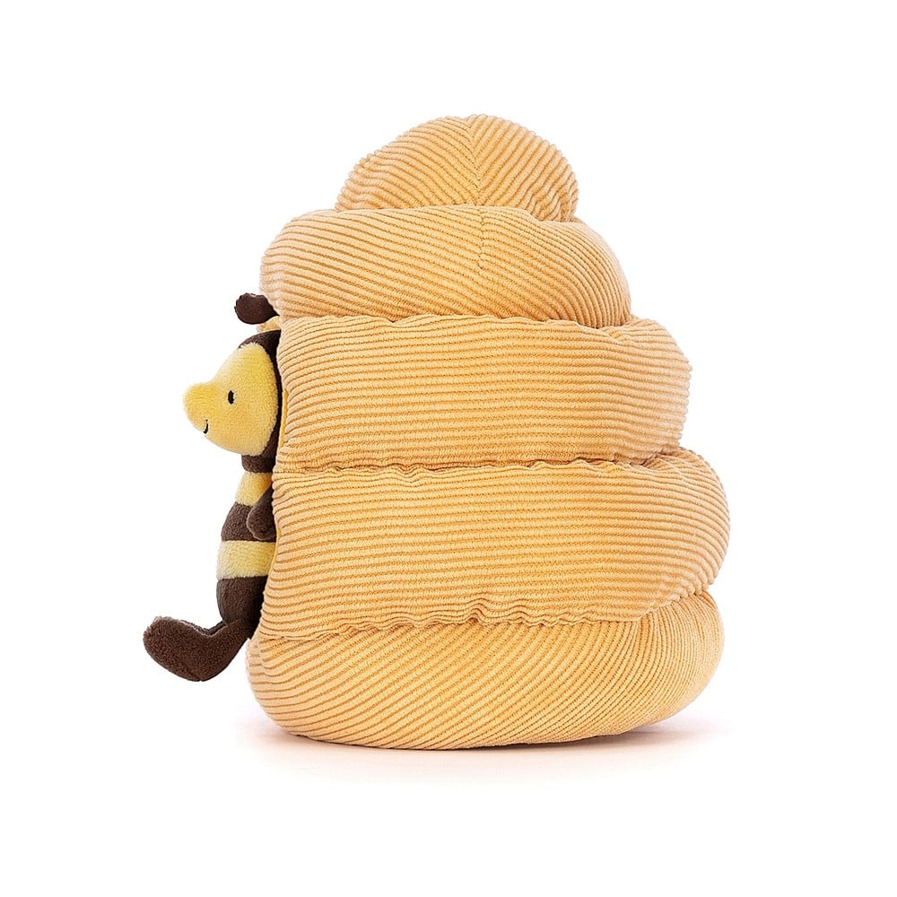 Side view of buzzing joy! Jellycat's Honeyhome Bee showcases their soft fur, playful pose, & cozy hive from the side. Ready for adventures! 
