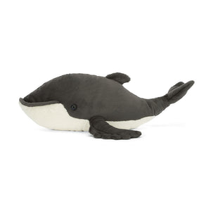 A side-profile image of Jellycat Humphrey the Humpback Whale, highlighting his streamlined plush body, embroidered details, and realistic humpback whale shape.