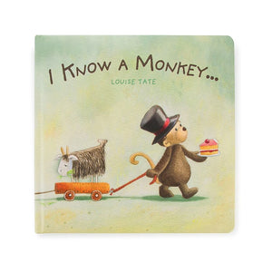 Straight On:  Storytime fun with a twist! The open Jellycat I Know A Monkey Book showcases a colorful illustration of a mischievous monkey and the text "I Know A Monkey."