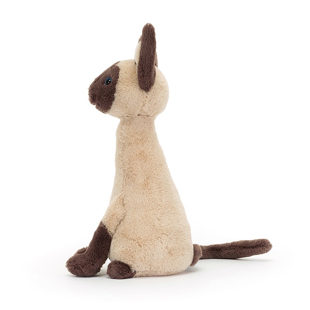 Side view of feline sophistication: Jellycat Iris Siamese Cat showcases her sleek lines, long tail, & contrasting socks from the side. Ready for playful adventures!