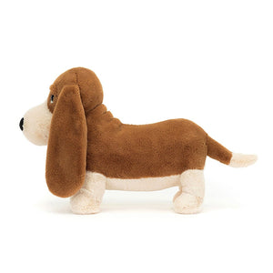 Basset charm in profile: This image of Jellycat Randall Basset Hound emphasizes his long body, wagging tail, & signature details. A loyal plush friend for all.
