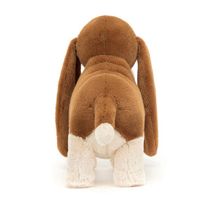 Jellycat Randall Basset Hound love unleashed: From behind, Randall exudes charm with his soft fur, playful tail, & droopy ears. Endless fun & cuddles await!